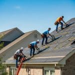 Roofing team repairing a residential roof in Mason, Ohio, emphasizing next day service urgency