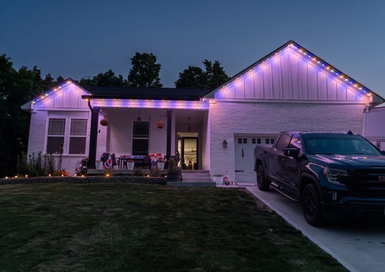 Home lit in Halloween orange and purple