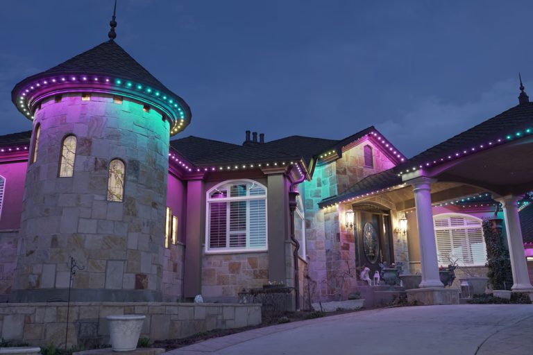 Roofline lit in color for an evening at home