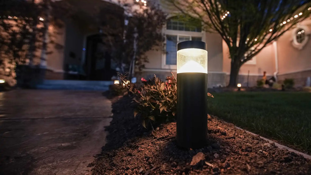 JellyFish cylinder lights in a garden bed